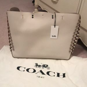 Coach “LNK LT DET ROGUE TOTE” in chalk